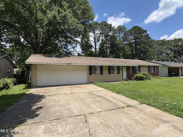 3435 Casa Grande Cir, Jackson, MS 39209 - ranch-style home with driveway, a front yard, an attached garage, and brick siding
