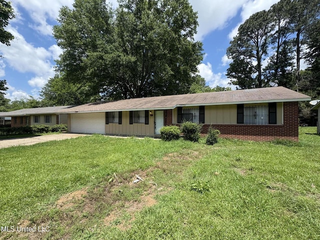 3435 Casa Grande Cir, Jackson, MS 39209 - single story home featuring a garage, brick siding, a front yard, and driveway