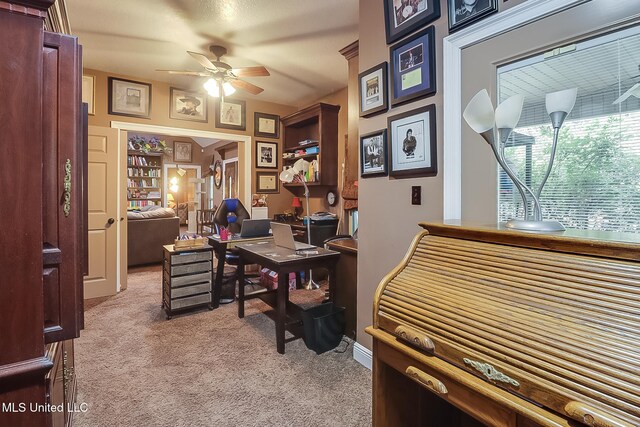 office featuring light carpet and ceiling fan