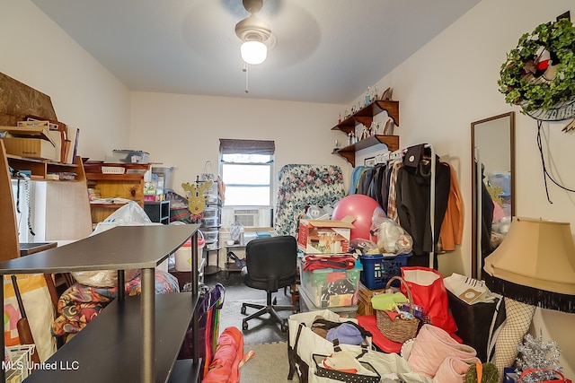 home office featuring ceiling fan, cooling unit, and carpet floors