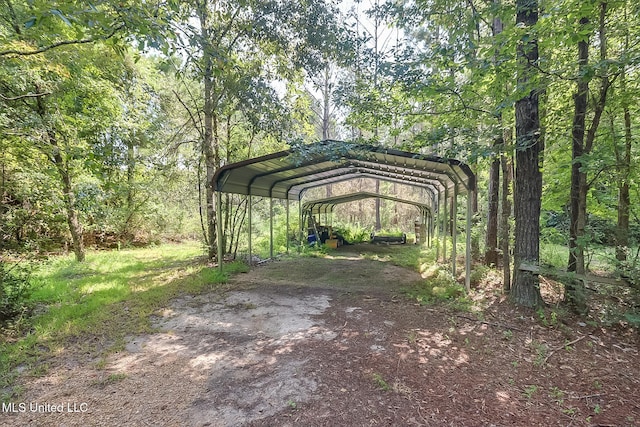 view of vehicle parking featuring a carport