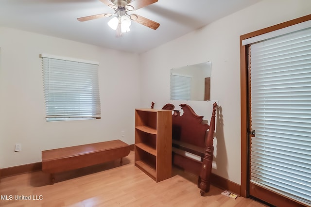 bedroom with ceiling fan and light hardwood / wood-style flooring