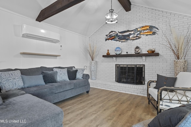 living area featuring lofted ceiling with beams, a wall unit AC, a fireplace, and wood finished floors