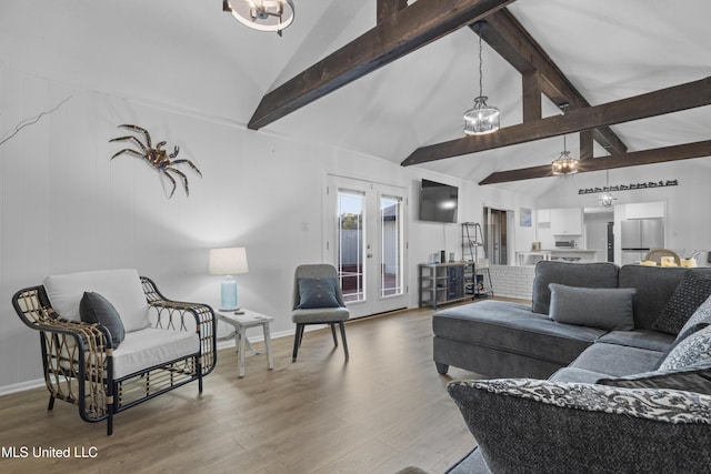 living area featuring high vaulted ceiling, french doors, wood finished floors, and beam ceiling