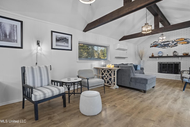 living room featuring a fireplace, beam ceiling, wood finished floors, and a wall mounted air conditioner