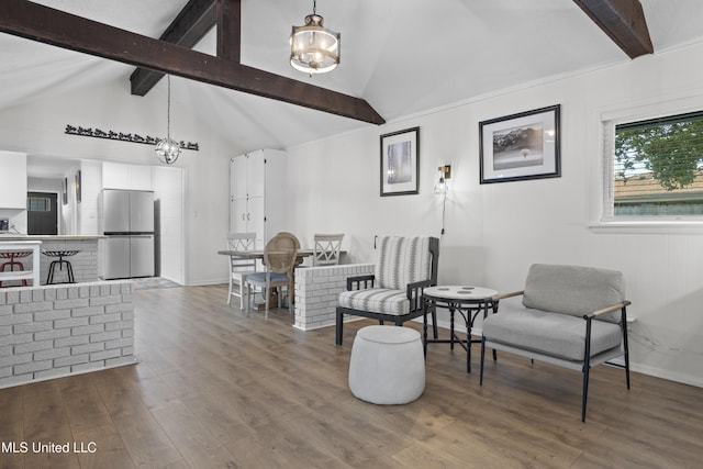 living area with vaulted ceiling with beams, baseboards, and dark wood finished floors