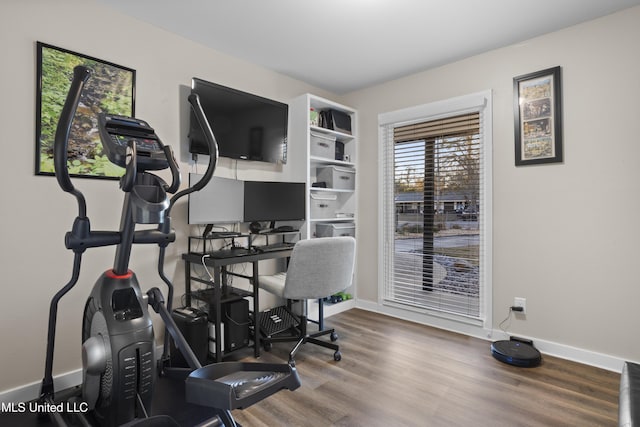 office area featuring wood finished floors and baseboards