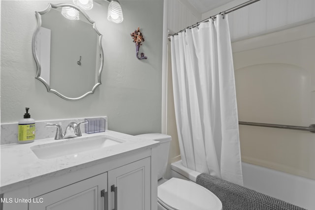 full bath with vanity, toilet, and shower / bath combo with shower curtain