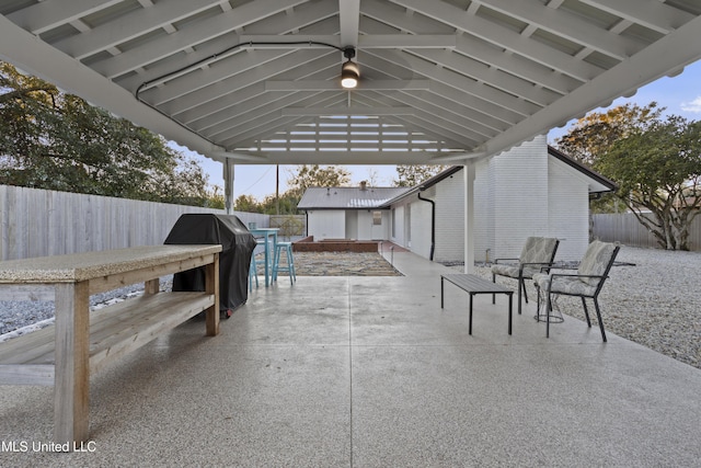 view of patio featuring a gazebo, area for grilling, and a fenced backyard