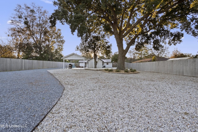 rear view of property with fence private yard and a gazebo