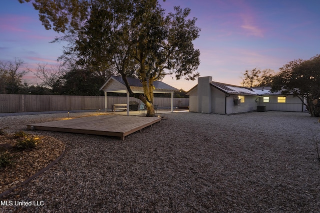 view of yard featuring fence and a wooden deck