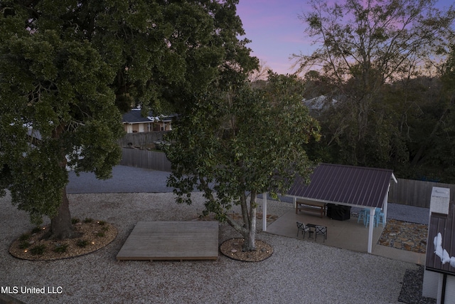 exterior space with a patio and fence