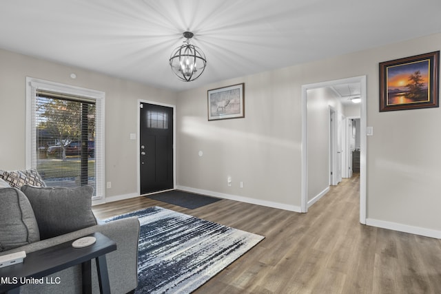 entrance foyer with wood finished floors and baseboards