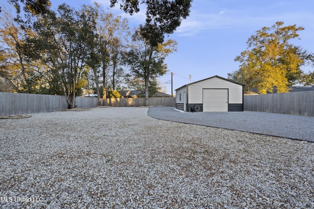 view of yard featuring a fenced backyard and an outdoor structure