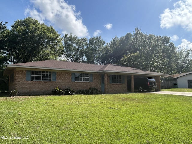ranch-style house with brick siding, a front yard, an attached carport, and concrete driveway