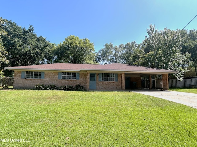 ranch-style house with a carport, concrete driveway, a front lawn, and brick siding