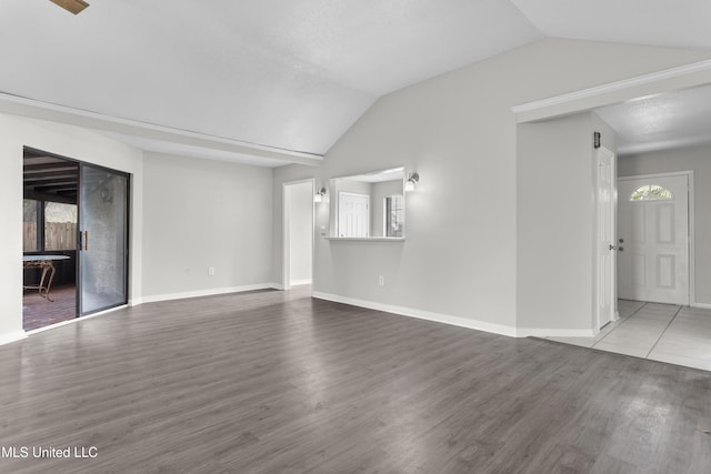 unfurnished living room with wood-type flooring and lofted ceiling