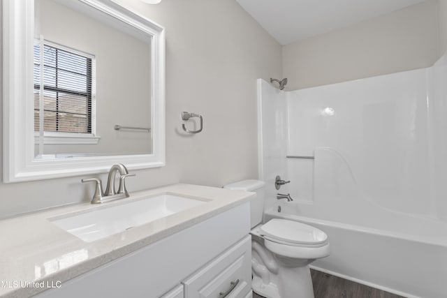 full bathroom with shower / tub combination, vanity, toilet, and wood-type flooring