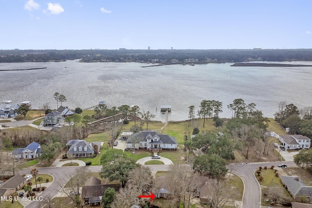 birds eye view of property featuring a water view