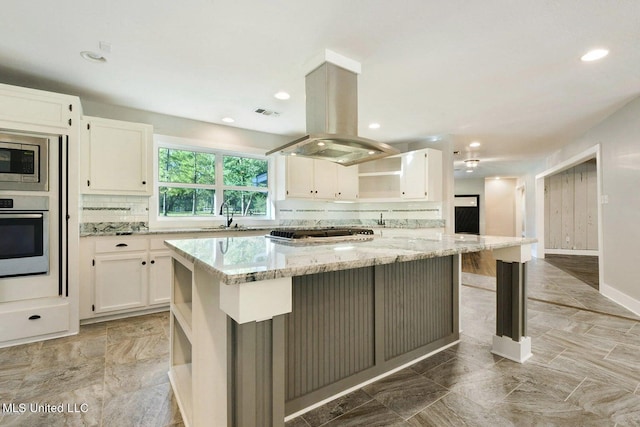 18153 Doc Lizana Rd, Gulfport, MS 39503 - kitchen featuring decorative backsplash, light stone counters, stainless steel appliances, open shelves, and a sink