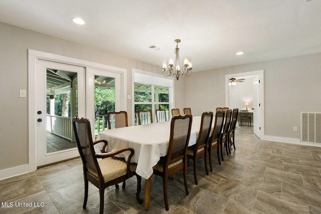 18153 Doc Lizana Rd, Gulfport, MS 39503 - dining space featuring visible vents, a notable chandelier, and baseboards