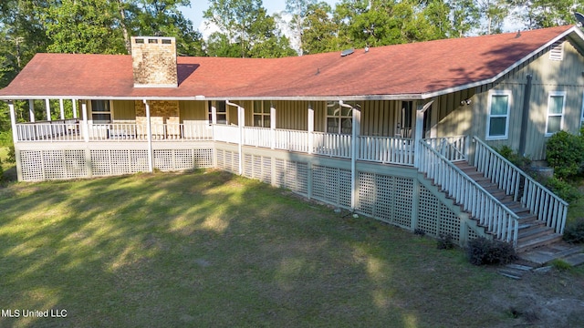 18153 Doc Lizana Rd, Gulfport, MS 39503 - view of front of house featuring a chimney, covered porch, stairway, a shingled roof, and a front lawn