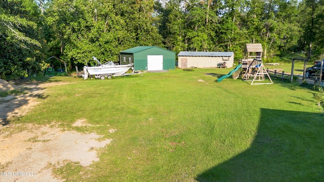 18153 Doc Lizana Rd, Gulfport, MS 39503 - view of yard with an outdoor structure, a storage shed, and a playground