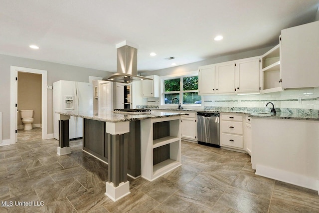 18153 Doc Lizana Rd, Gulfport, MS 39503 - kitchen featuring light stone counters, island range hood, open shelves, and stainless steel appliances