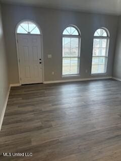 entryway with wood finished floors and baseboards