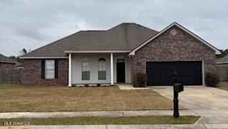 ranch-style house with a garage and concrete driveway