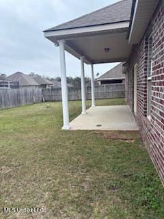 view of yard with a patio area and fence