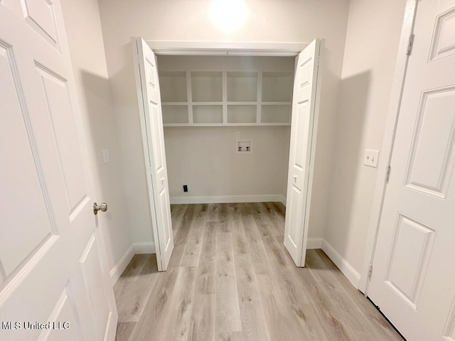 washroom featuring washer hookup and light hardwood / wood-style flooring