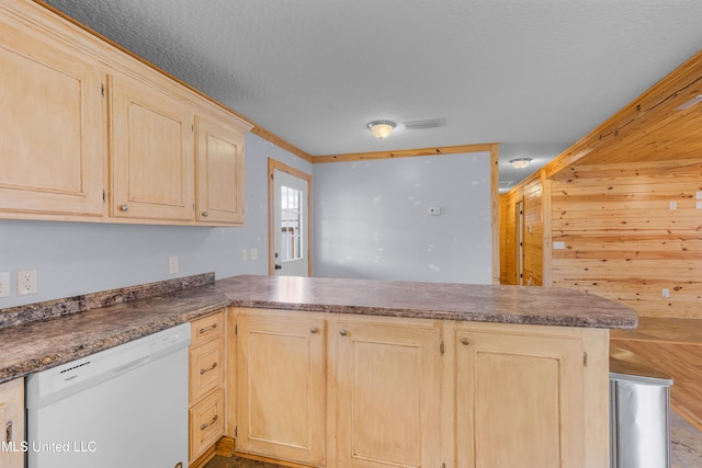 kitchen featuring light brown cabinetry, dishwasher, kitchen peninsula, and wooden walls