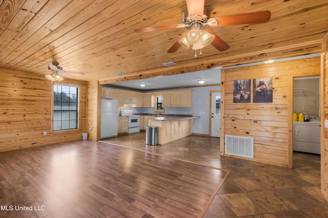 kitchen with wood ceiling, washer / clothes dryer, a breakfast bar area, white appliances, and dark hardwood / wood-style flooring