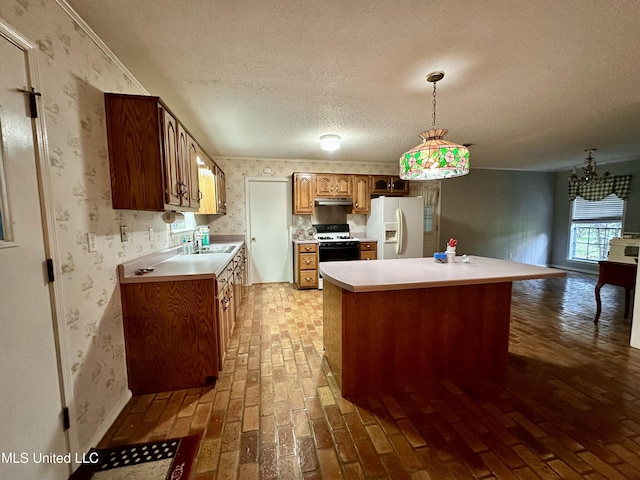 3427 Jr Davis Rd, Moss Point, MS 39562 - kitchen featuring white fridge with ice dispenser, wallpapered walls, a textured ceiling, range, and brick floor
