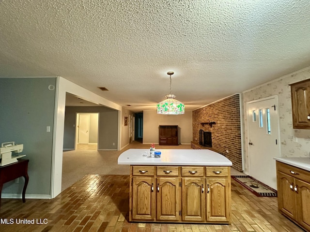 3427 Jr Davis Rd, Moss Point, MS 39562 - kitchen with open floor plan, a textured ceiling, visible vents, light countertops, and brick floor