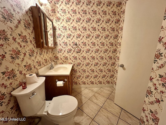 3427 Jr Davis Rd, Moss Point, MS 39562 - bathroom with wallpapered walls, toilet, baseboards, tile patterned floors, and vanity