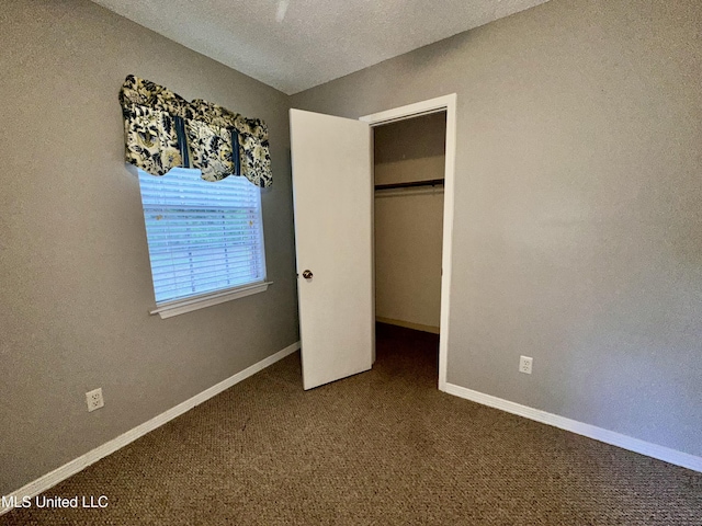 3427 Jr Davis Rd, Moss Point, MS 39562 - unfurnished bedroom with carpet flooring, a closet, and baseboards