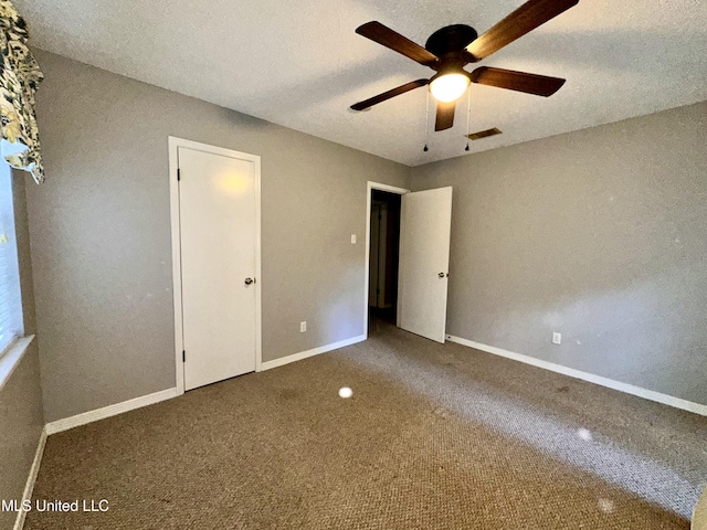 3427 Jr Davis Rd, Moss Point, MS 39562 - unfurnished bedroom featuring baseboards, a ceiling fan, visible vents, and carpet floors