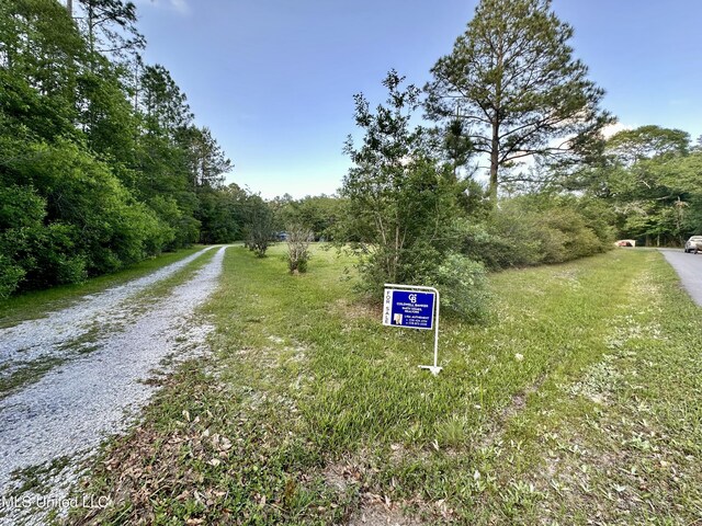 3427 Jr Davis Rd, Moss Point, MS 39562 - view of street with a forest view