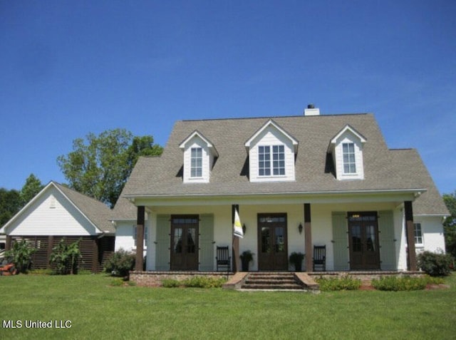 cape cod-style house with a porch and a front lawn