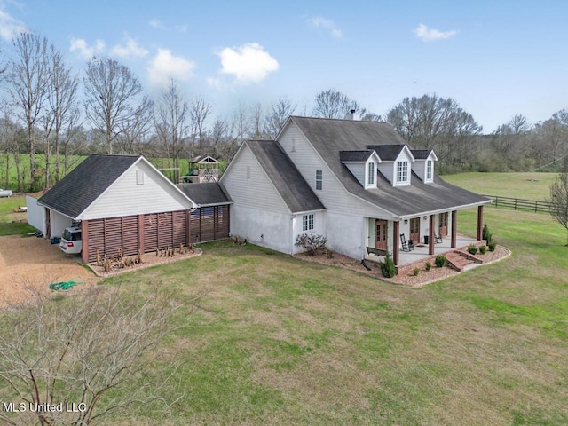 exterior space with fence and a yard