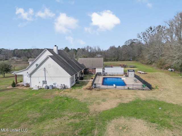 view of pool featuring fence, a lawn, and a fenced in pool