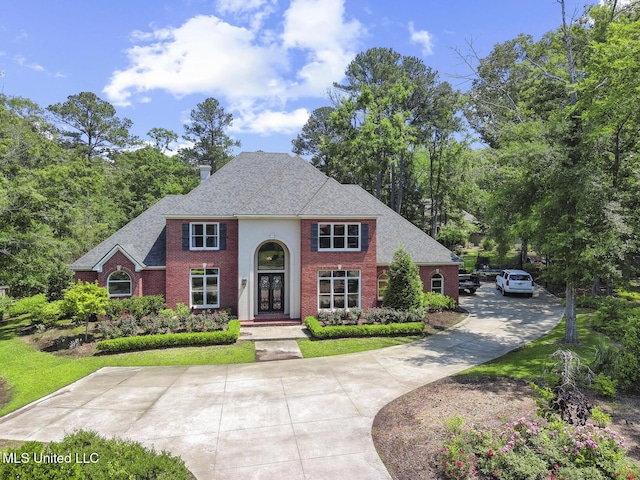 340 Sherborne Pl, Flowood, MS 39232 - view of front of house with brick siding and roof with shingles