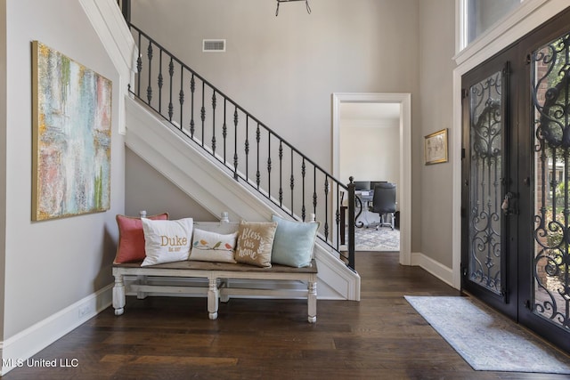 340 Sherborne Pl, Flowood, MS 39232 - foyer entrance featuring stairs, a high ceiling, wood finished floors, and baseboards