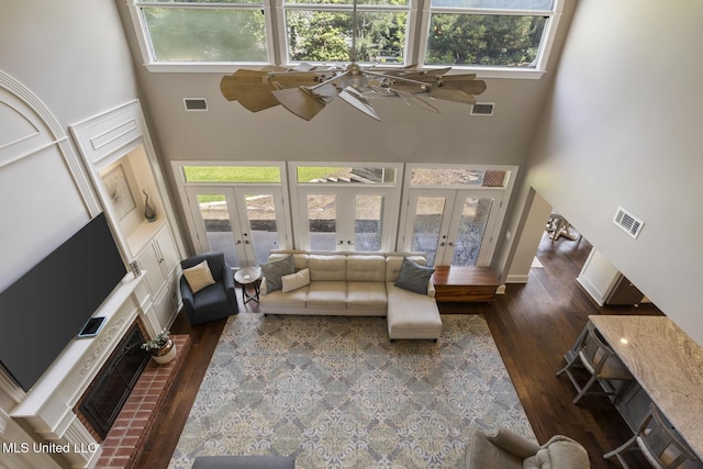 340 Sherborne Pl, Flowood, MS 39232 - living area with french doors, a towering ceiling, healthy amount of natural light, and dark wood-style floors