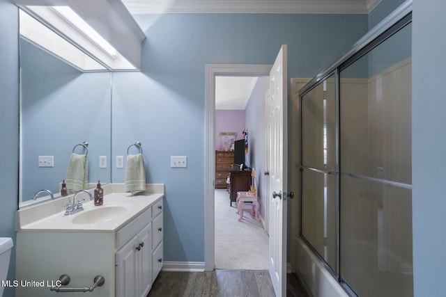 340 Sherborne Pl, Flowood, MS 39232 - full bathroom with wood finished floors, vanity, toilet, bath / shower combo with glass door, and ornamental molding