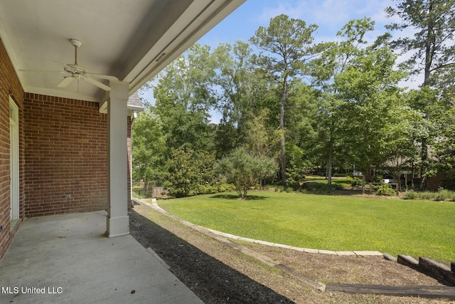 340 Sherborne Pl, Flowood, MS 39232 - view of green lawn with a ceiling fan, a patio, and view of wooded area