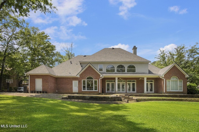 340 Sherborne Pl, Flowood, MS 39232 - back of property with french doors, brick siding, and a lawn