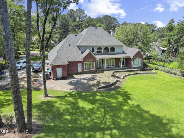 340 Sherborne Pl, Flowood, MS 39232 - view of front of house featuring brick siding, covered porch, roof with shingles, and view of scattered trees